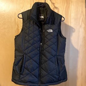 The North Face Vest, womens size medium. Black with grey/silver logo.
